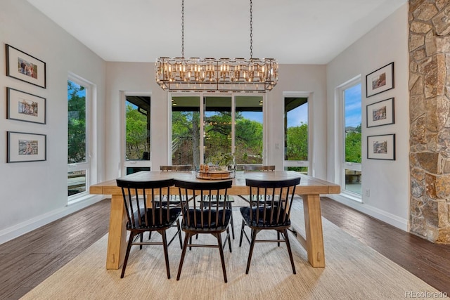 5428 Forest View Rd, Parker, CO 80134 - dining room with baseboards, light wood-style floors, and a chandelier
