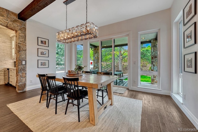 5428 Forest View Rd, Parker, CO 80134 - dining space with a chandelier, dark wood-style floors, baseboards, and beam ceiling