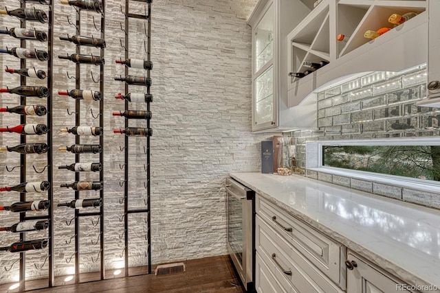 5428 Forest View Rd, Parker, CO 80134 - wine cellar featuring dark wood finished floors