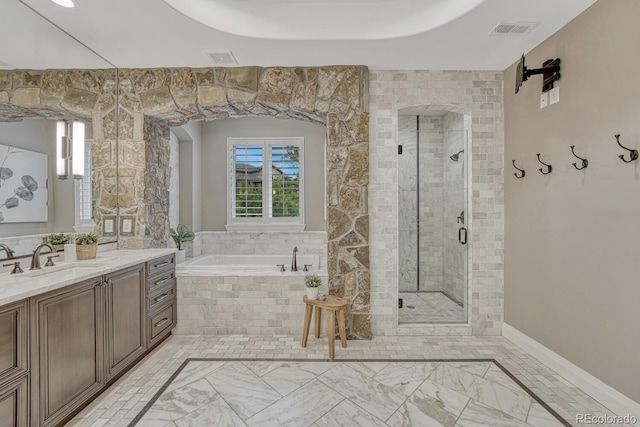 5428 Forest View Rd, Parker, CO 80134 - full bathroom featuring vanity, a garden tub, a stall shower, and marble finish flooring