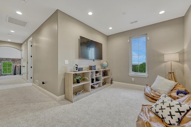 5428 Forest View Rd, Parker, CO 80134 - sitting room with carpet floors, baseboards, recessed lighting, healthy amount of natural light, and arched walkways