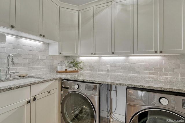 5428 Forest View Rd, Parker, CO 80134 - laundry area featuring cabinet space and washing machine and clothes dryer