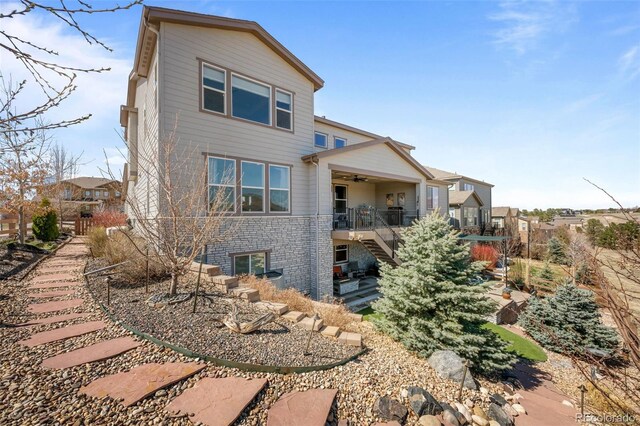 8172 S Langdale Way, Aurora, CO 80016 - back of house featuring stairway, ceiling fan, brick siding, and a wooden deck