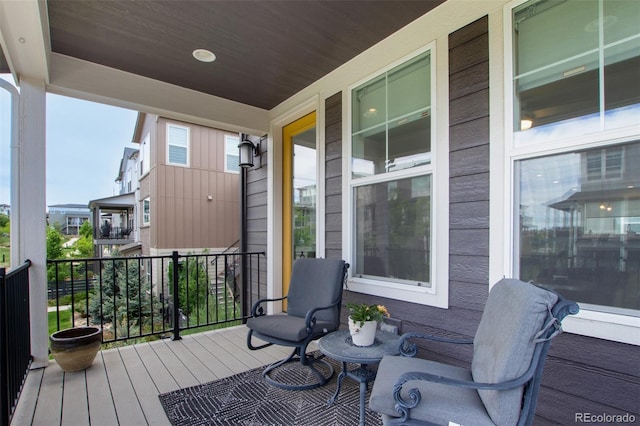 8958 Southurst St, Littleton, CO 80129 - deck featuring a porch