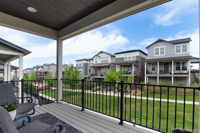 8958 Southurst St, Littleton, CO 80129 - wooden deck with a residential view and a yard