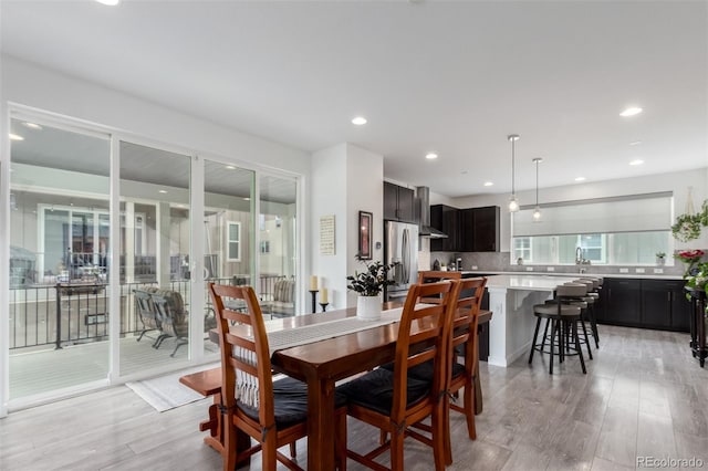 8958 Southurst St, Littleton, CO 80129 - dining space with light wood-style floors and recessed lighting