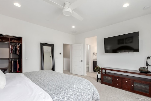8958 Southurst St, Littleton, CO 80129 - bedroom featuring light carpet, recessed lighting, a closet, ensuite bath, and a walk in closet
