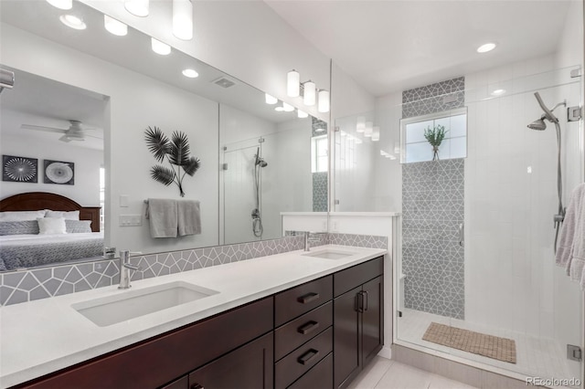 8958 Southurst St, Littleton, CO 80129 - bathroom with ensuite bathroom, a stall shower, double vanity, ceiling fan, and recessed lighting