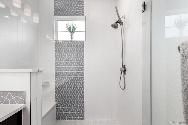 8958 Southurst St, Littleton, CO 80129 - bathroom featuring a tile shower and vanity