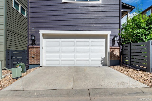 8958 Southurst St, Littleton, CO 80129 - garage with driveway and fence