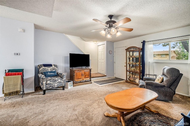 living room with carpet floors, a textured ceiling, and ceiling fan