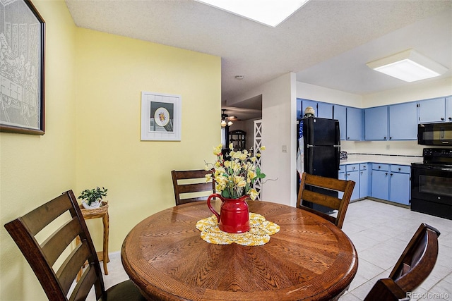 dining space featuring light tile patterned floors