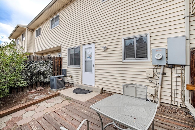 deck featuring central AC unit and fence