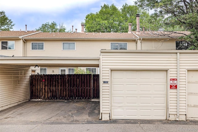 view of front of house featuring fence