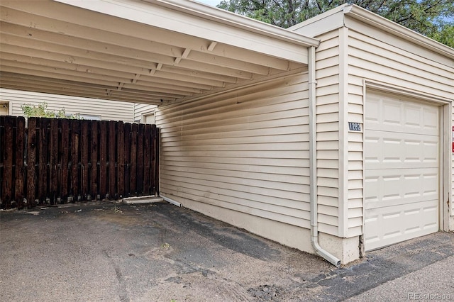 garage with fence