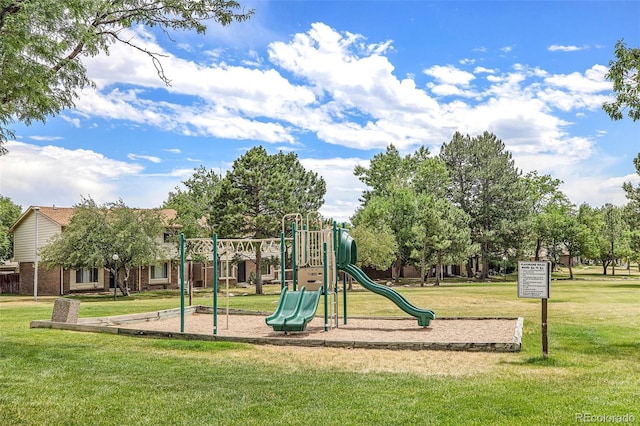 communal playground featuring a yard