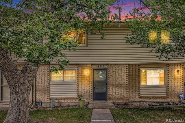 view of front of house featuring brick siding