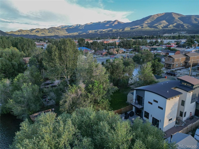 birds eye view of property with a mountain view