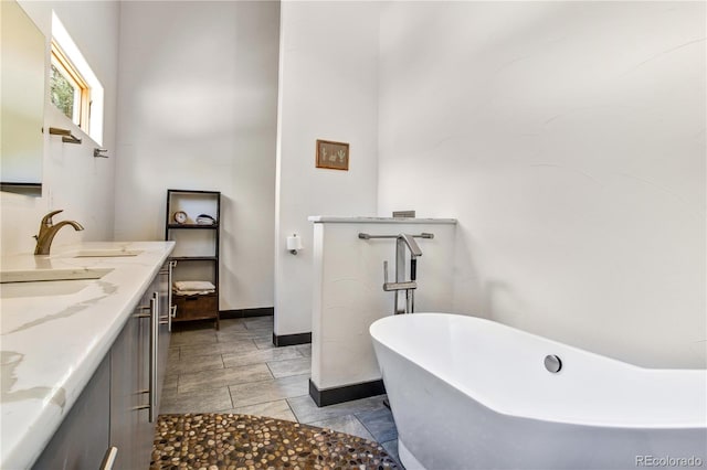 bathroom featuring a tub and vanity