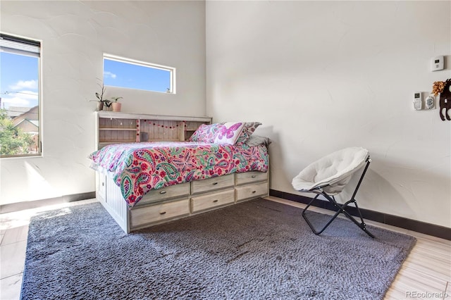 bedroom with multiple windows