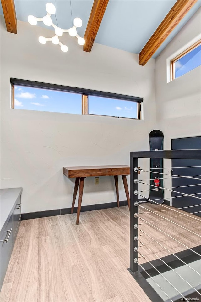 office area with hardwood / wood-style floors and beamed ceiling