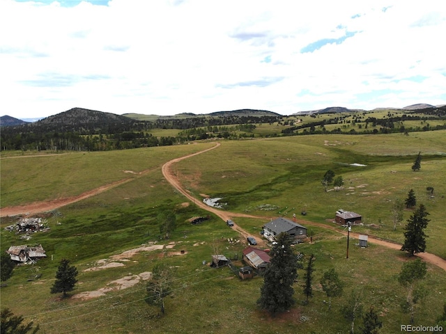 bird's eye view featuring a mountain view and a rural view