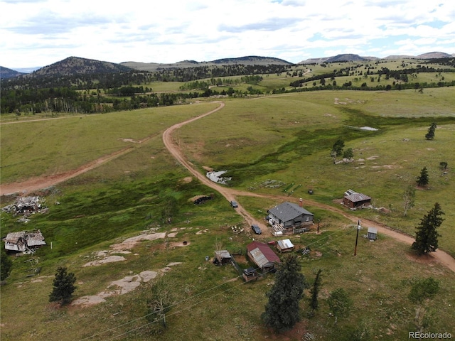 aerial view featuring a rural view and a mountain view