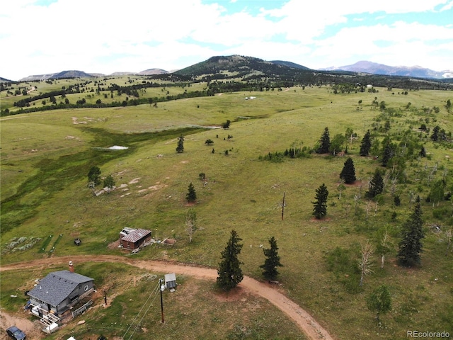 bird's eye view featuring a rural view and a mountain view