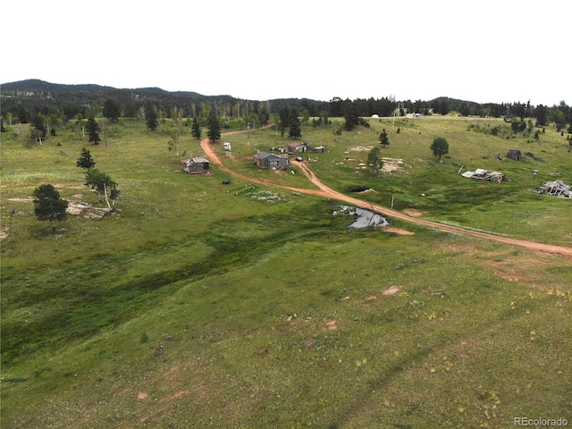 birds eye view of property featuring a rural view