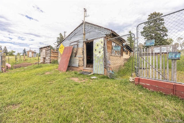 view of outbuilding featuring an outbuilding and fence