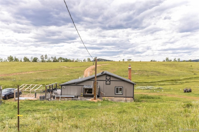 view of pole building featuring a rural view