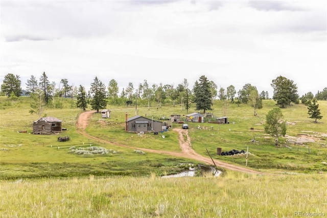 birds eye view of property featuring a rural view