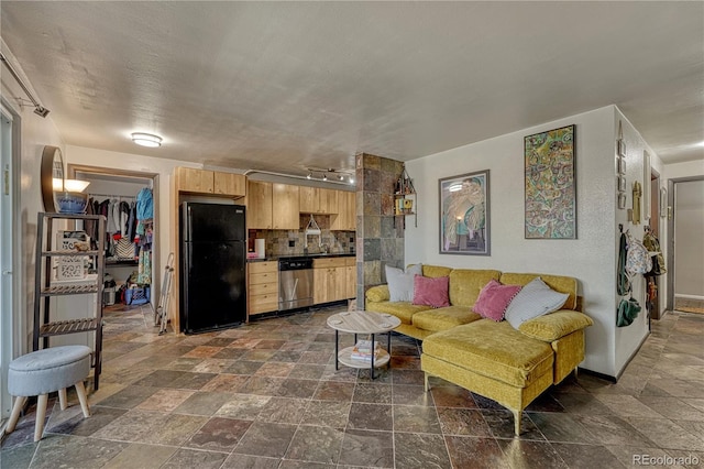 living room featuring a textured ceiling and stone finish flooring