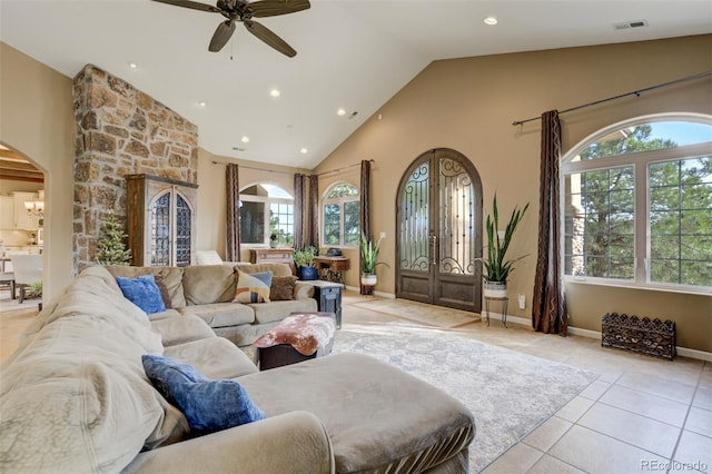 8320 Red Spring Valley Rd, Colorado Springs, CO 80919 - living room with arched walkways, a ceiling fan, recessed lighting, light tile patterned floors, and high vaulted ceiling