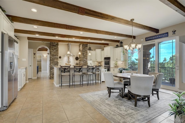 8320 Red Spring Valley Rd, Colorado Springs, CO 80919 - dining room featuring arched walkways, beam ceiling, light tile patterned floors, recessed lighting, and a chandelier