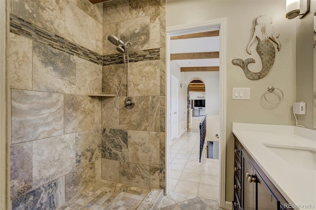 8320 Red Spring Valley Rd, Colorado Springs, CO 80919 - bathroom featuring a tile shower, vanity, and tile patterned floors