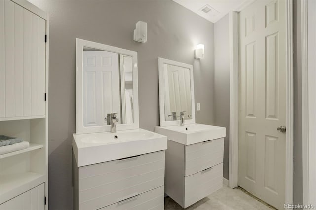 8320 Red Spring Valley Rd, Colorado Springs, CO 80919 - full bathroom featuring two vanities and tile patterned flooring