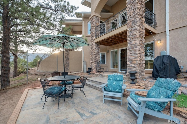 8320 Red Spring Valley Rd, Colorado Springs, CO 80919 - view of patio featuring outdoor dining space, a balcony, and grilling area