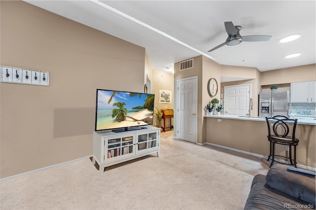 2428 W 82nd Pl Unit 1D, Westminster, CO 80031 - living area with light carpet and a ceiling fan