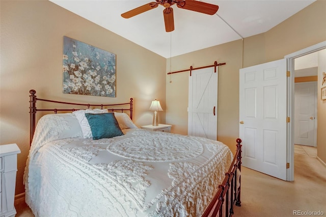 2428 W 82nd Pl Unit 1D, Westminster, CO 80031 - bedroom featuring light carpet, a barn door, and ceiling fan