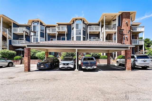 2428 W 82nd Pl Unit 1D, Westminster, CO 80031 - view of apartment building / complex with covered and uncovered parking