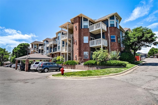 2428 W 82nd Pl Unit 1D, Westminster, CO 80031 - view of apartment building / complex featuring covered parking