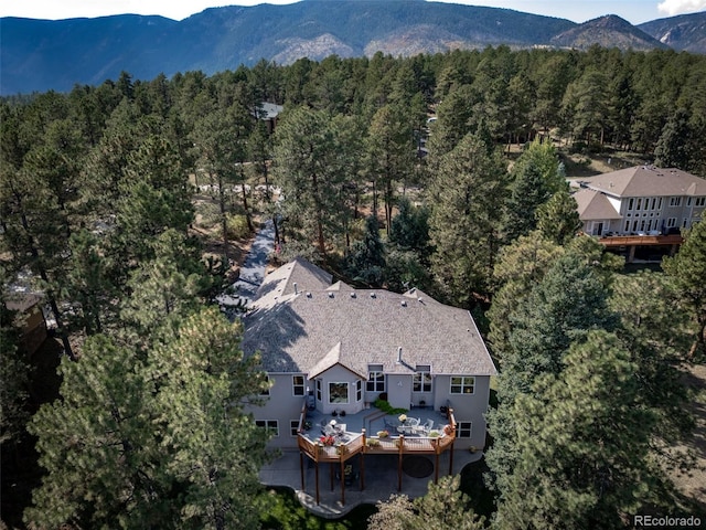 birds eye view of property featuring a mountain view