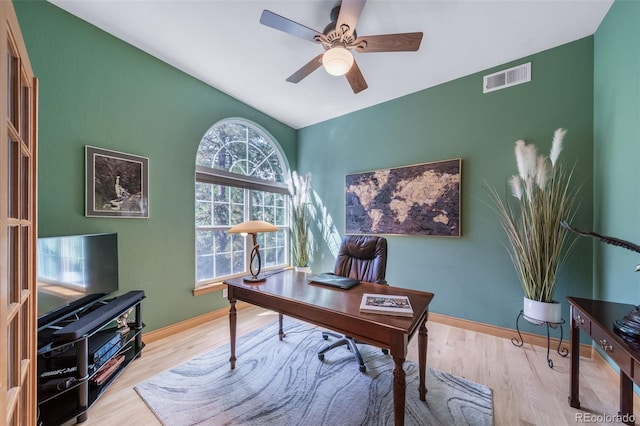 office featuring ceiling fan, light hardwood / wood-style floors, and lofted ceiling