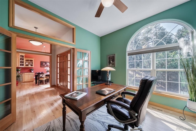 office area featuring light hardwood / wood-style flooring and ceiling fan