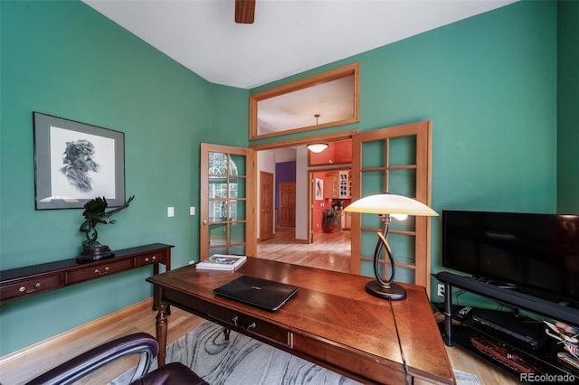 office area featuring light hardwood / wood-style floors and ceiling fan