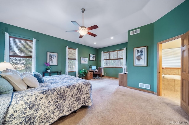 carpeted bedroom featuring ceiling fan and connected bathroom