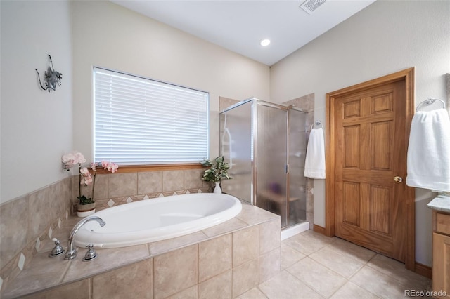 bathroom with tile patterned floors and independent shower and bath