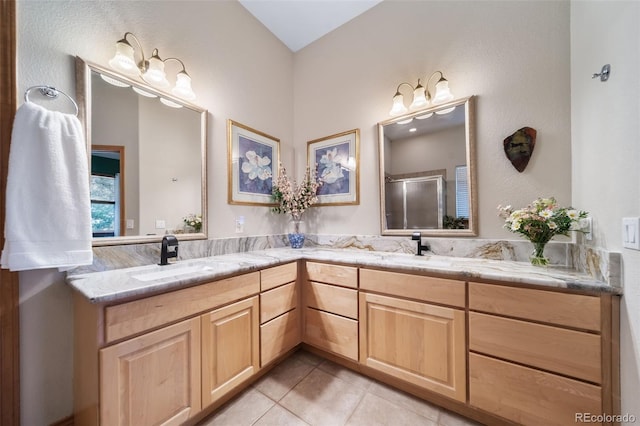 bathroom featuring vanity, walk in shower, and tile patterned flooring