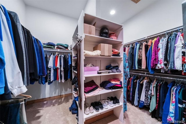 walk in closet with carpet